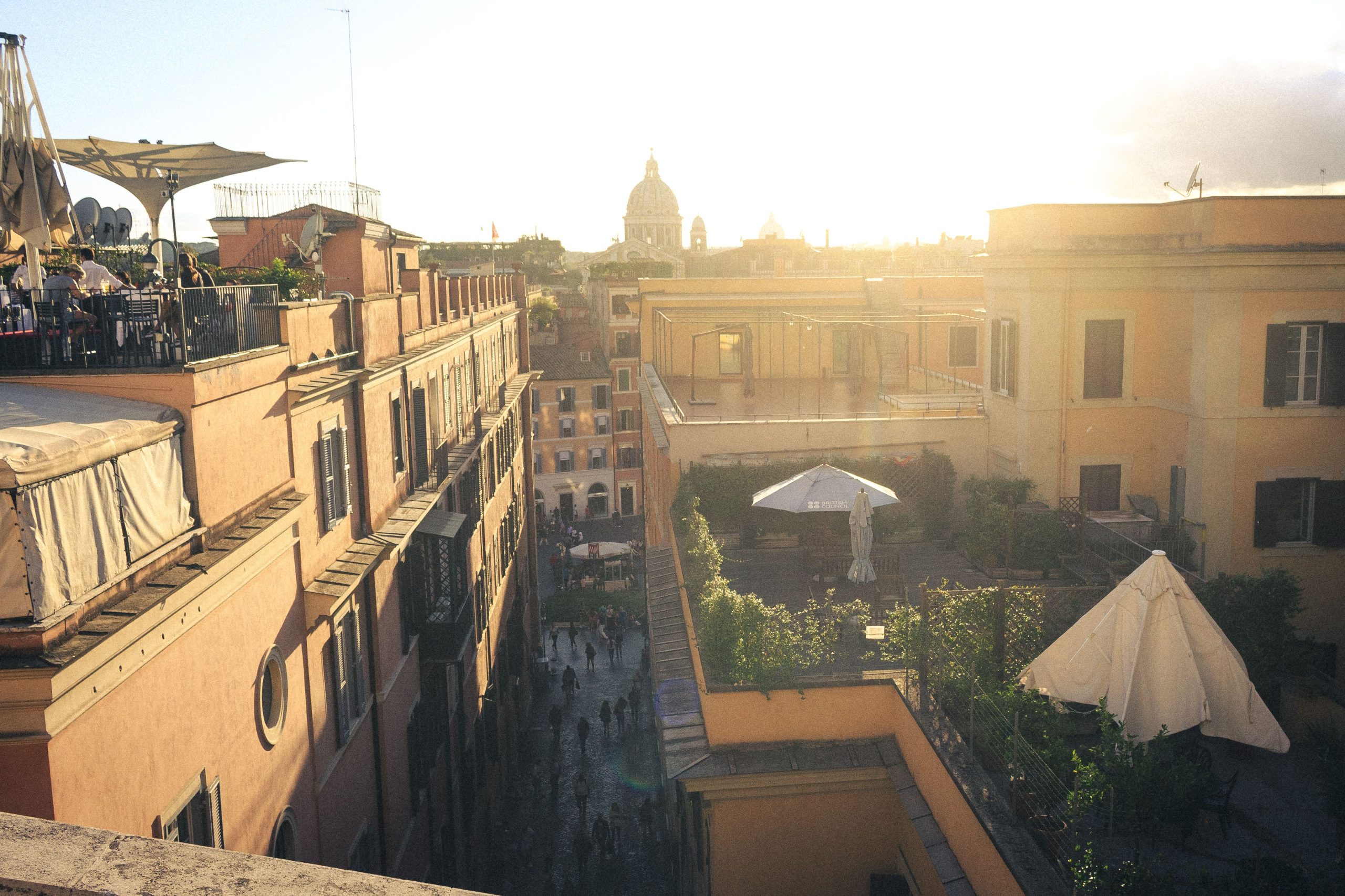 Warm sunset over Rome's historic rooftops, an atmospheric view for a luxury European city break.